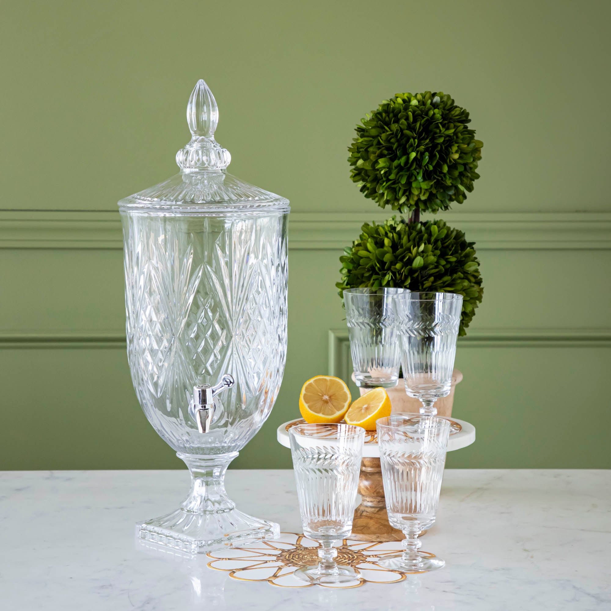 The Dublin Beverage Dispenser with 4 glasses styled with the Rattan Weave Serving Papers and Topiary Ball.