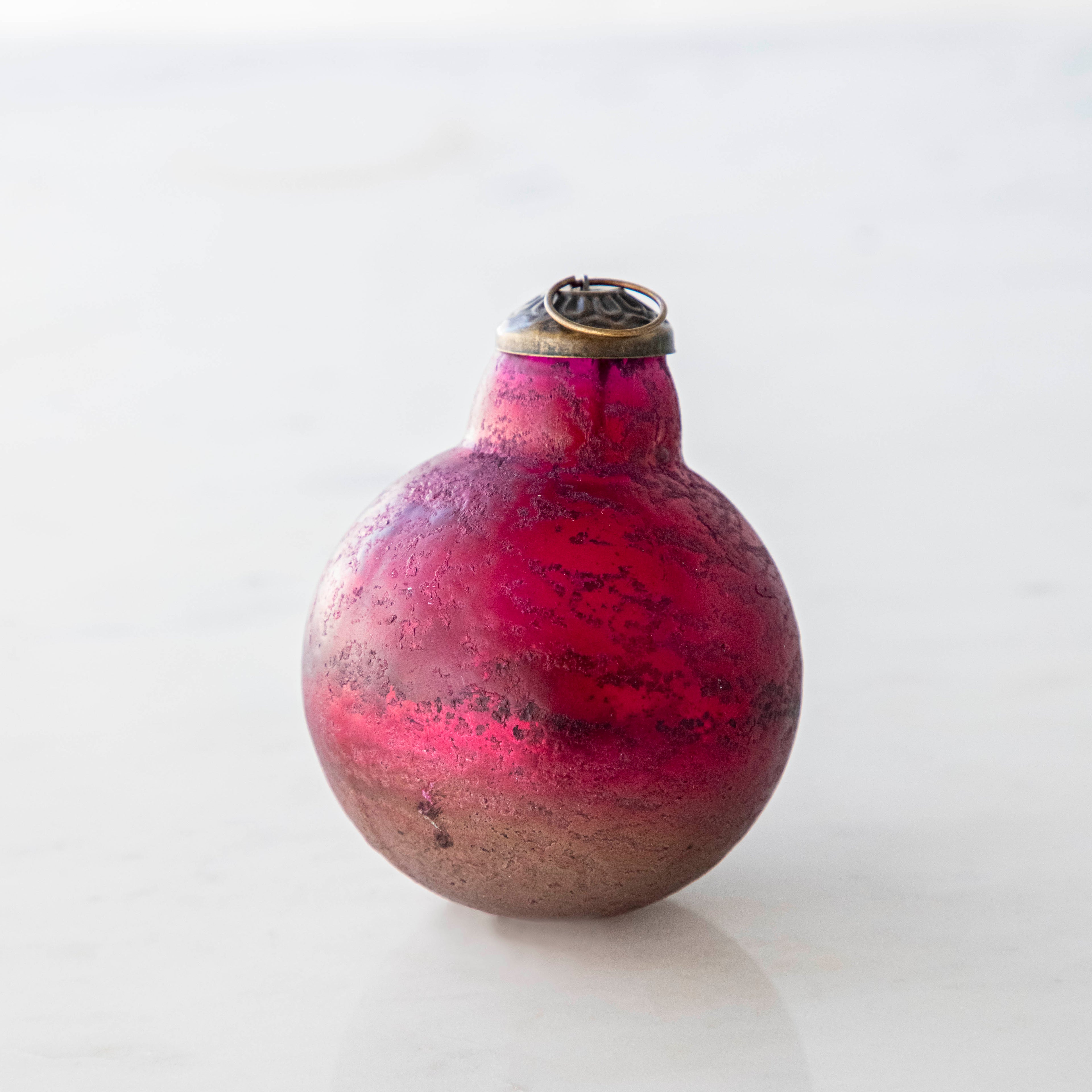 Pink Kugel Ornament on a white background