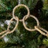 Gold & silver sparkly ring garland hanging in tree