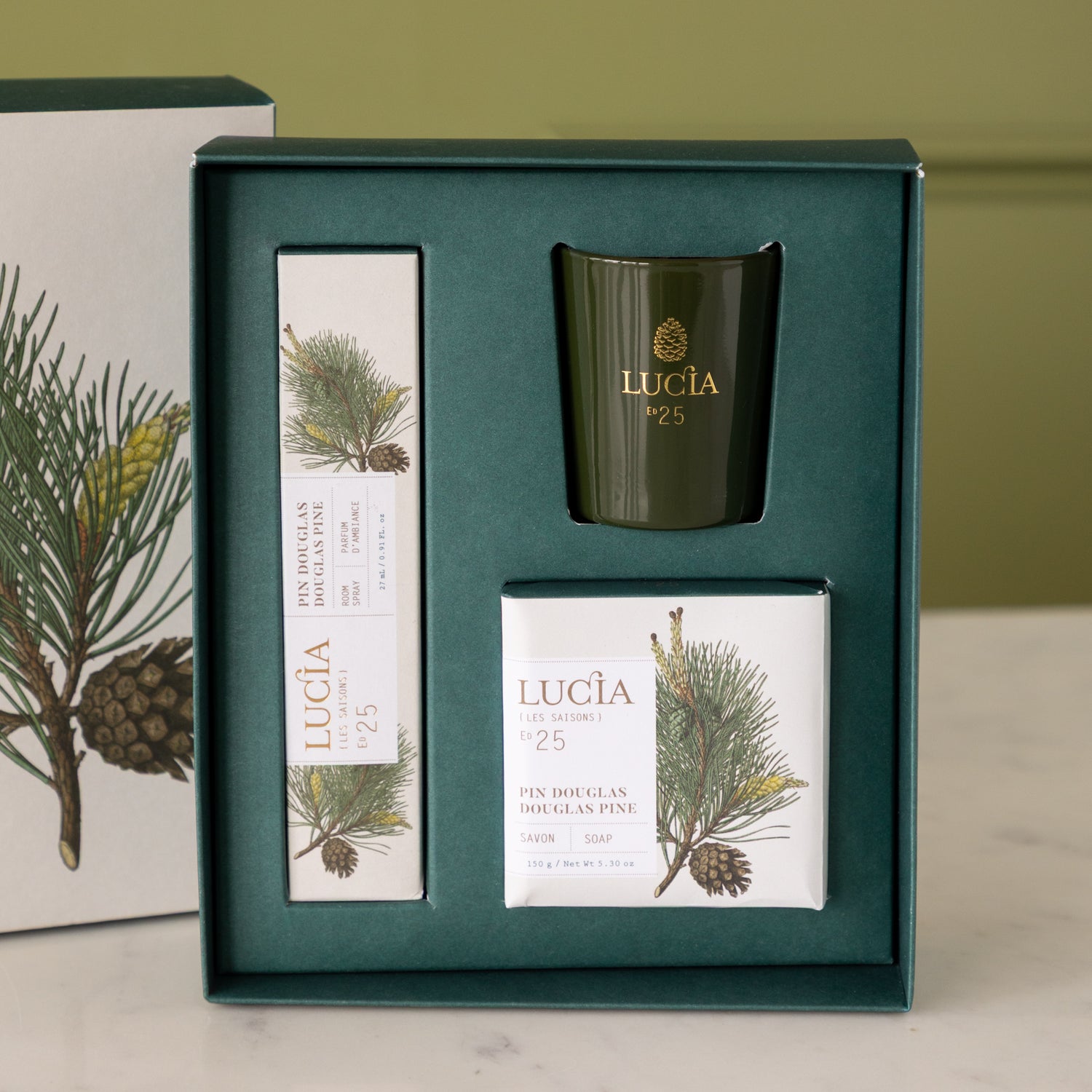 Gift set with candles and packaging featuring the brand Lucia.