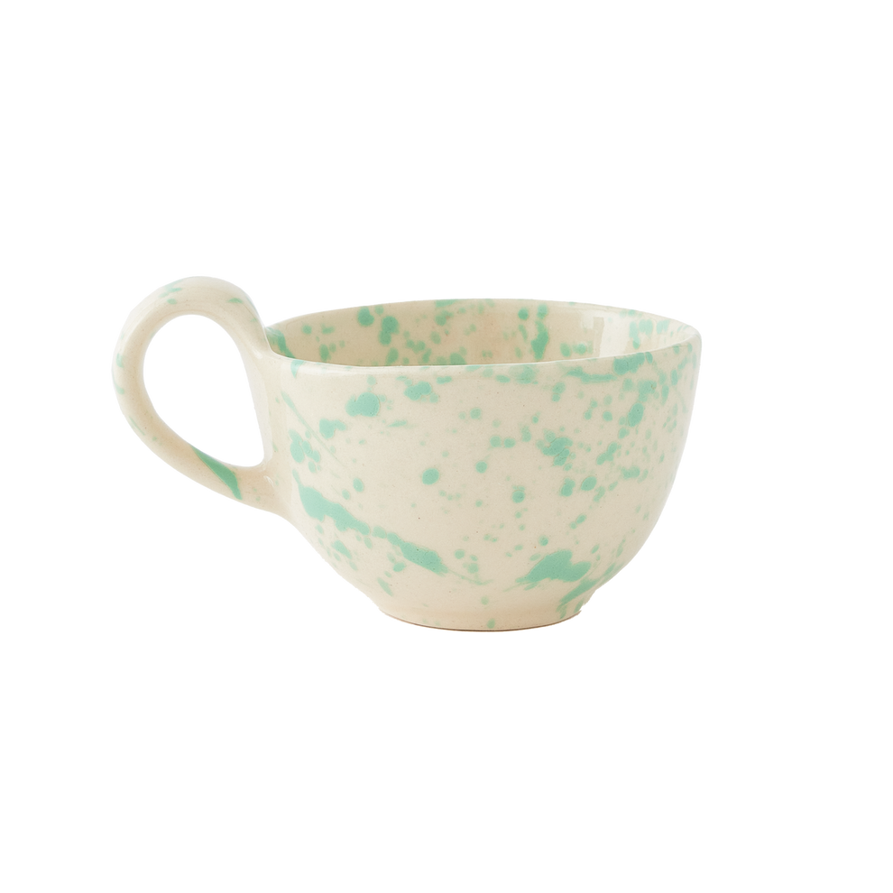 Speckled ceramic mug with green and beige pattern on a white background