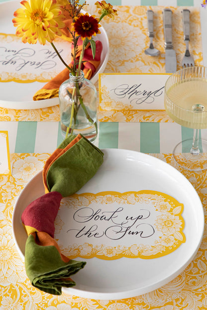 A yellow and green Spring Bouquet Placemat adorned with bohemian florals by Hester &amp; Cook.