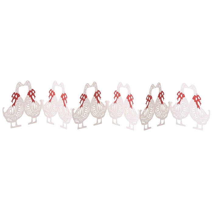 Decorative white paper geese with red ribbons on a white background.