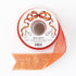 A spool of red and gold sparkle ribbon by Hester & Cook on a white background.