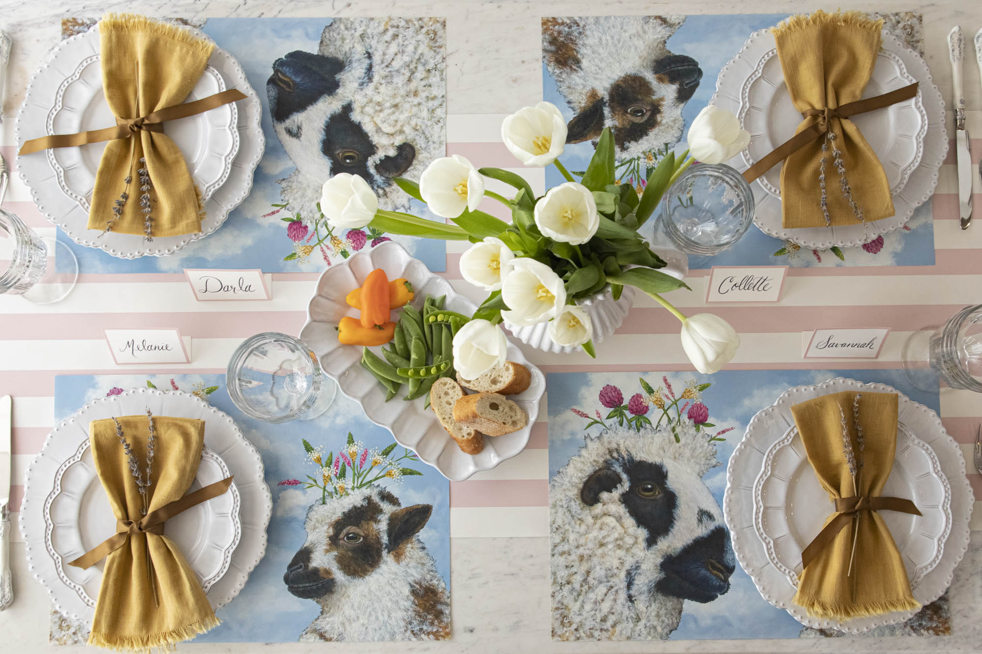 A spring table setting with a tablecloth and I Love Ewe placemats from Hester &amp; Cook.