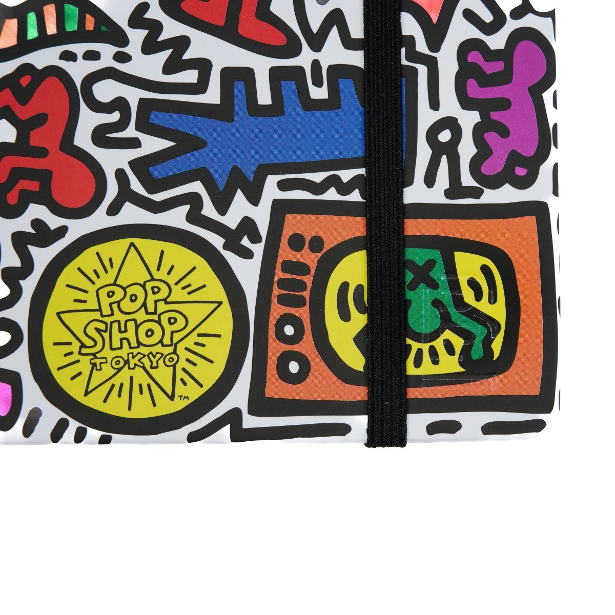 Close up of the Blackwing notebook with Keith Haring artwork printed on it. 