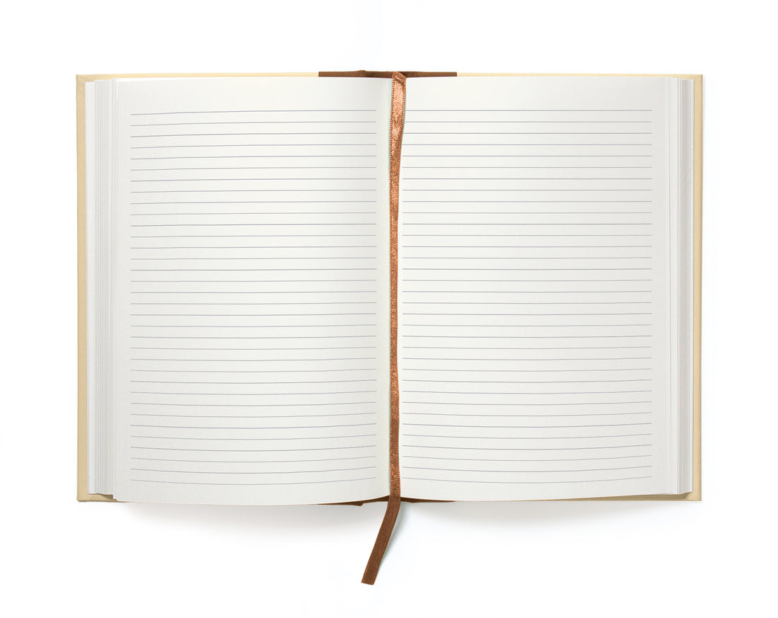Open notebook with lined pages on a white background.
