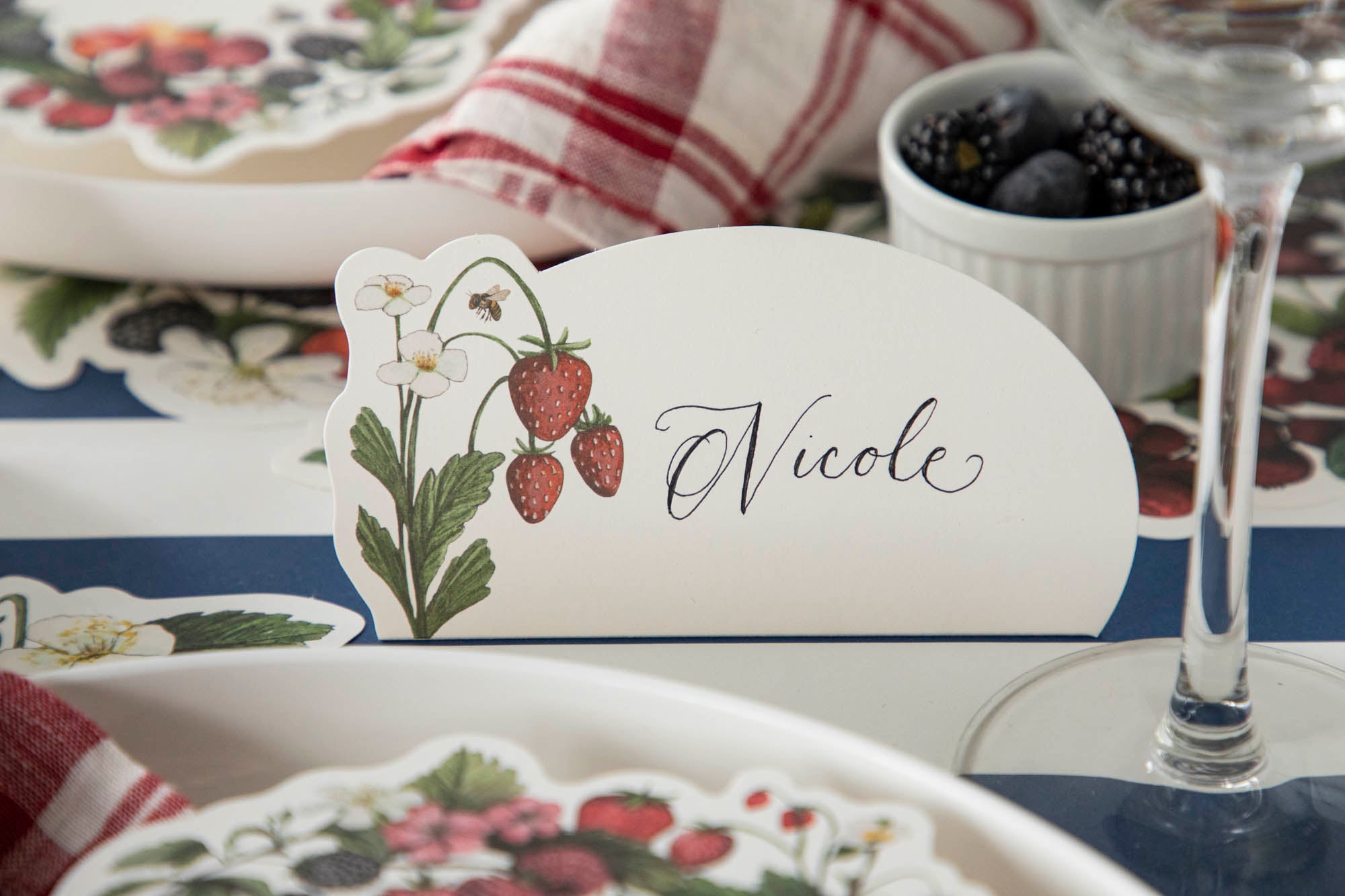 A close up of a Hester &amp; Cook Wild Berry Place Card with a summer strawberry design.