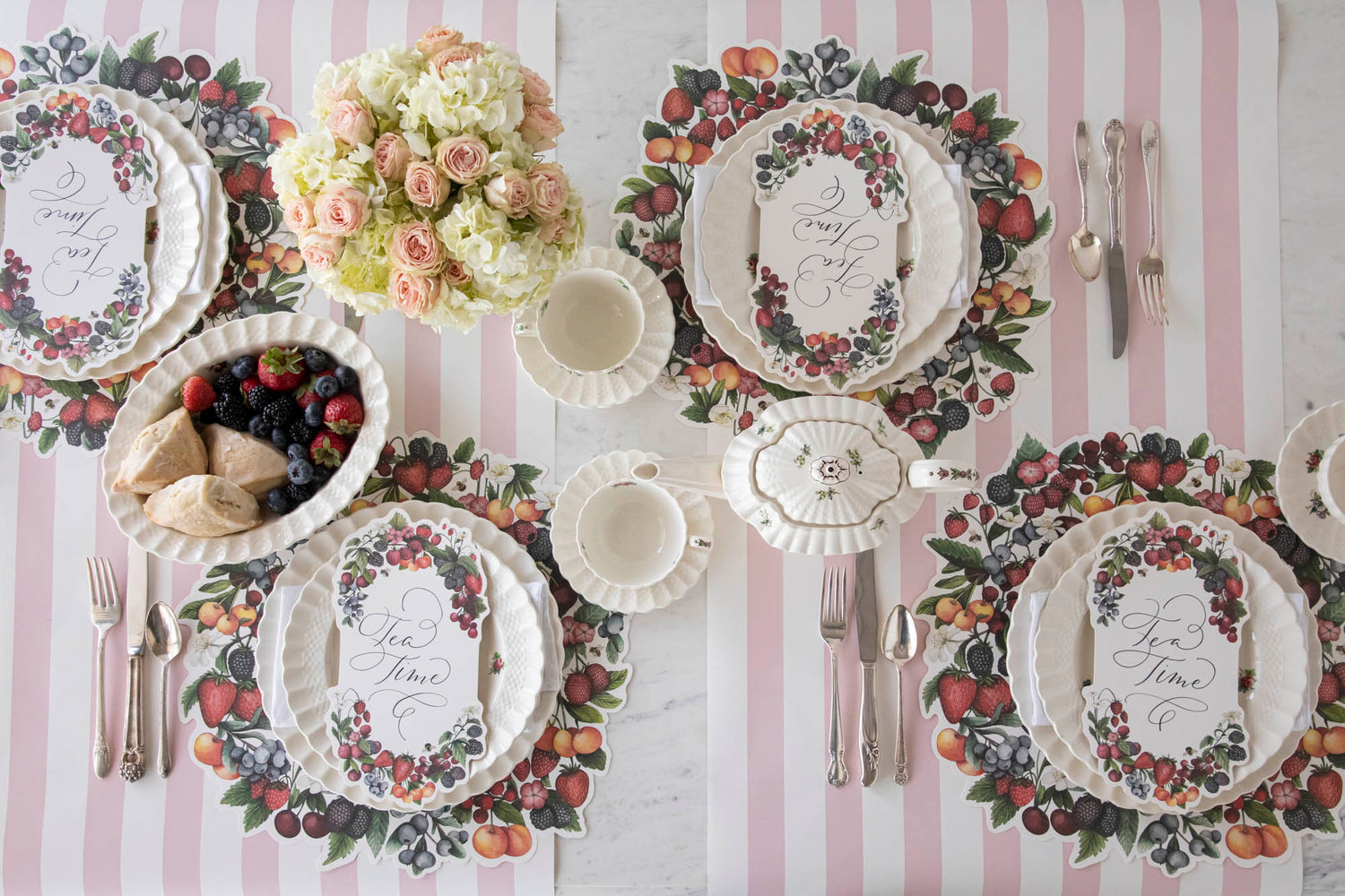 A tablescape with plates and cups decorated with Berry Bramble Table Card from Hester &amp; Cook.