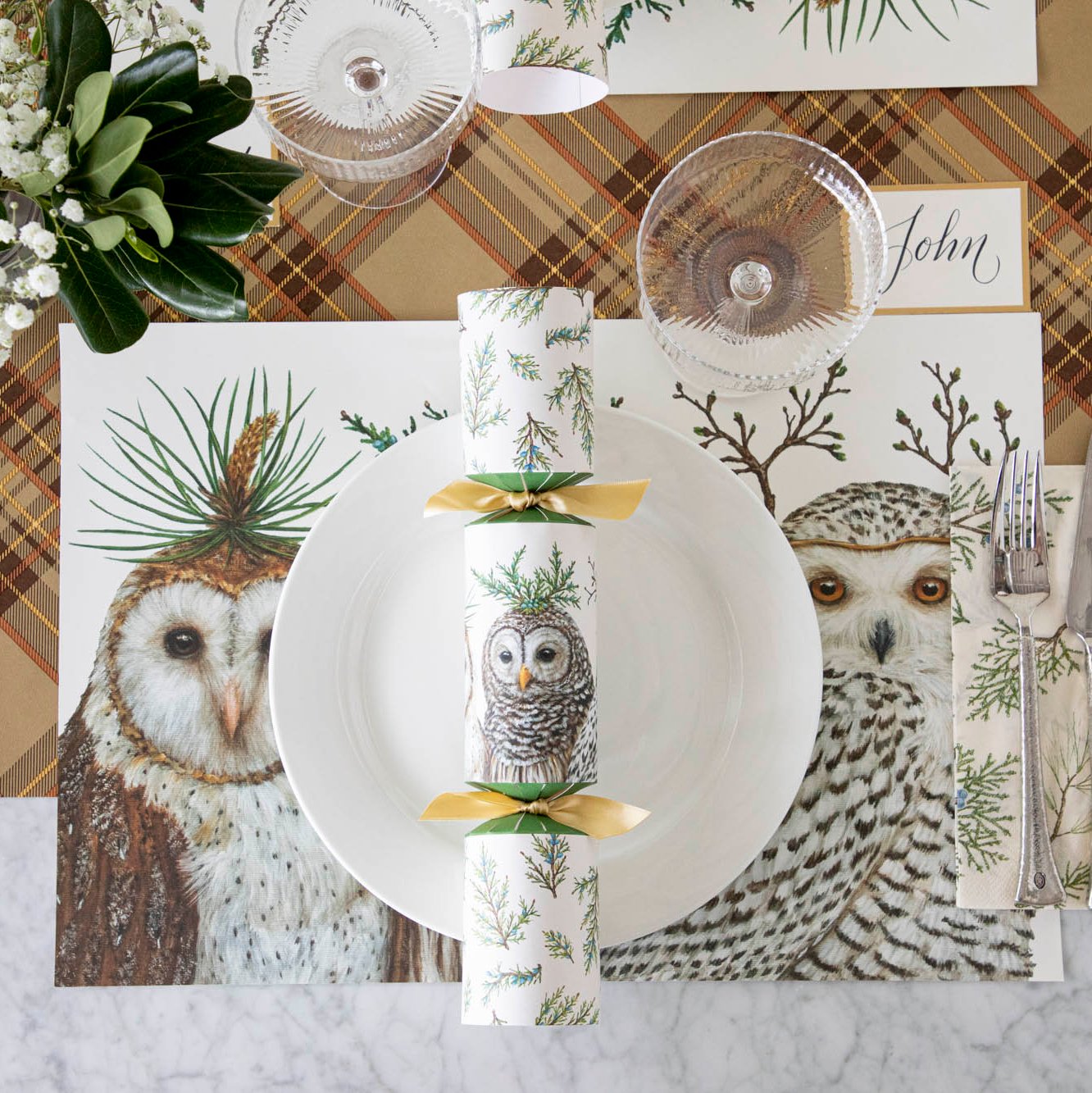 Elegant table setting with a Winter Owls Placemat with a white dinner plate and Winter Owls Cracker on top and Autumn Plaid Runner underneath.