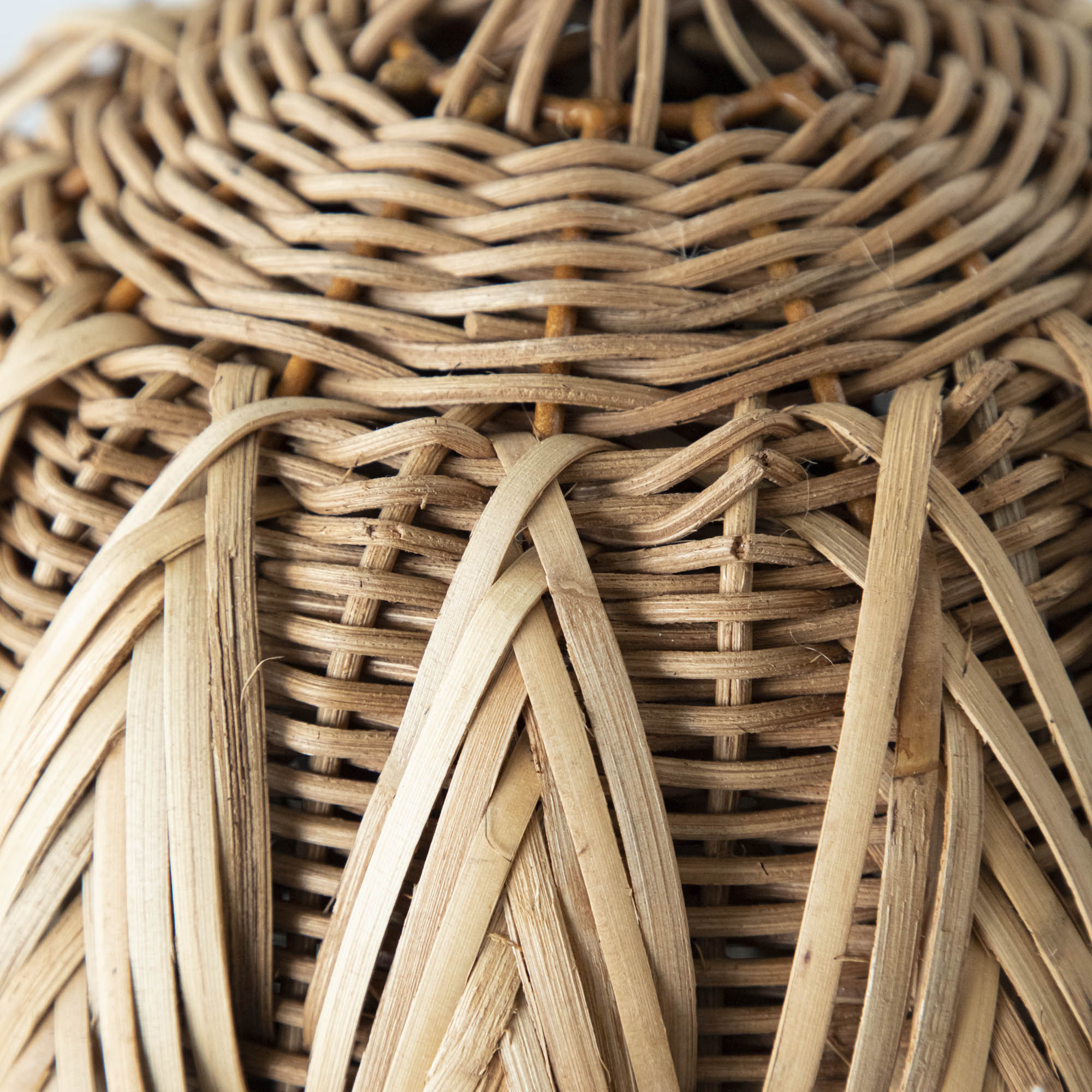 A close up of the wicker woven pumpkin.