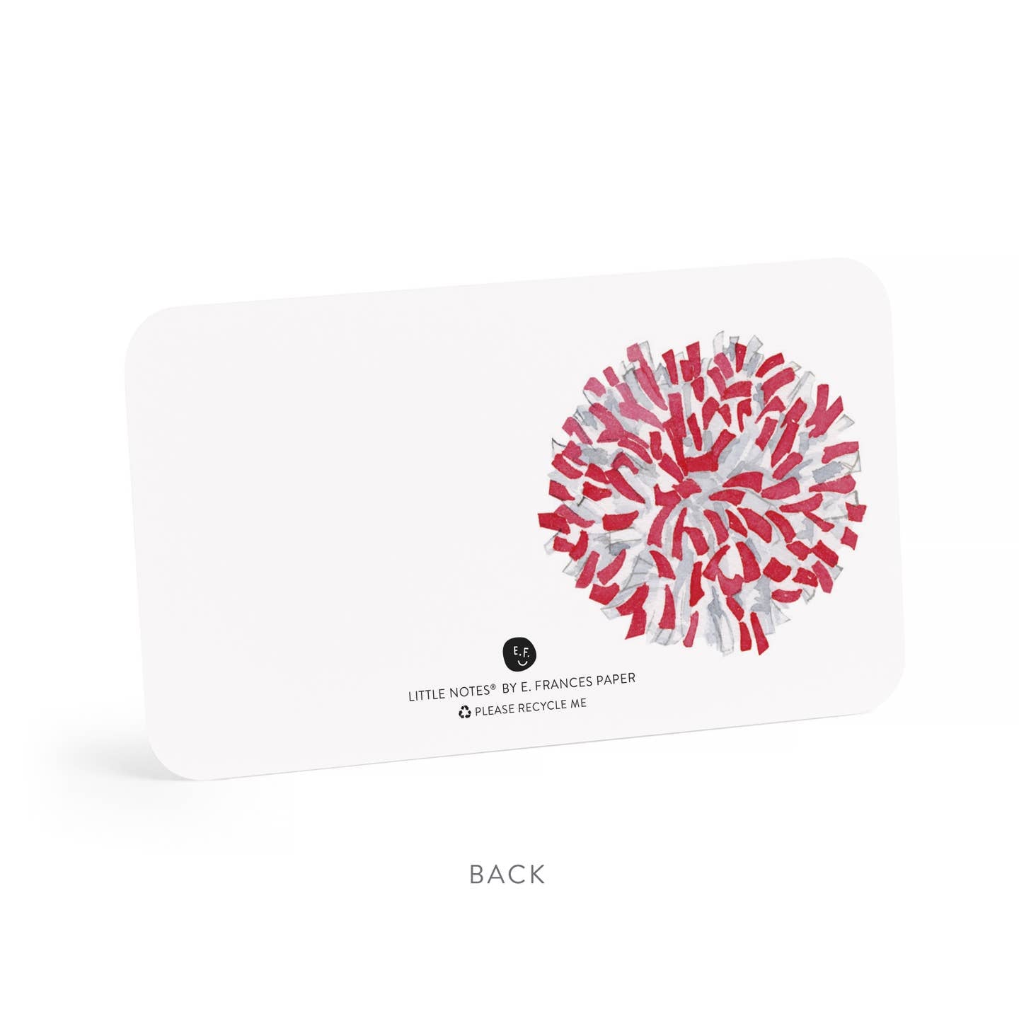 Note card with red and white pom pom design on a white background