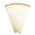 Set of 12 gold cocktail picks on a white background.