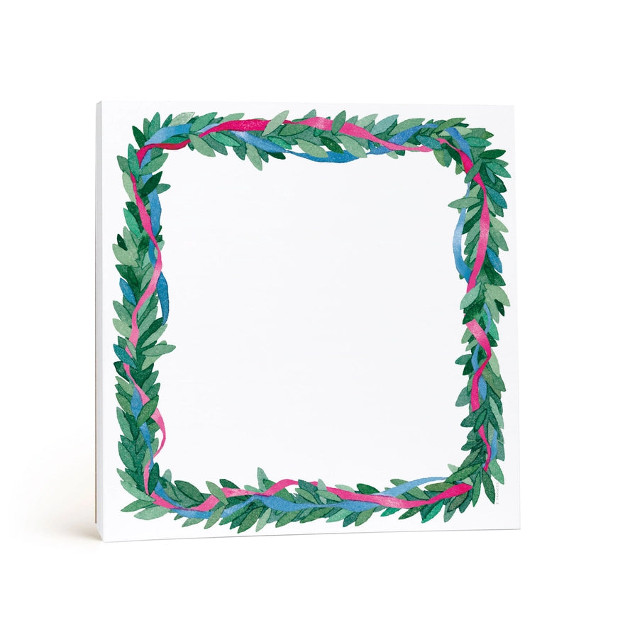 A square white notepad featuring a decorative watercolor-style border of green leaves with pink and blue ribbon accents, shown on a clean white background.