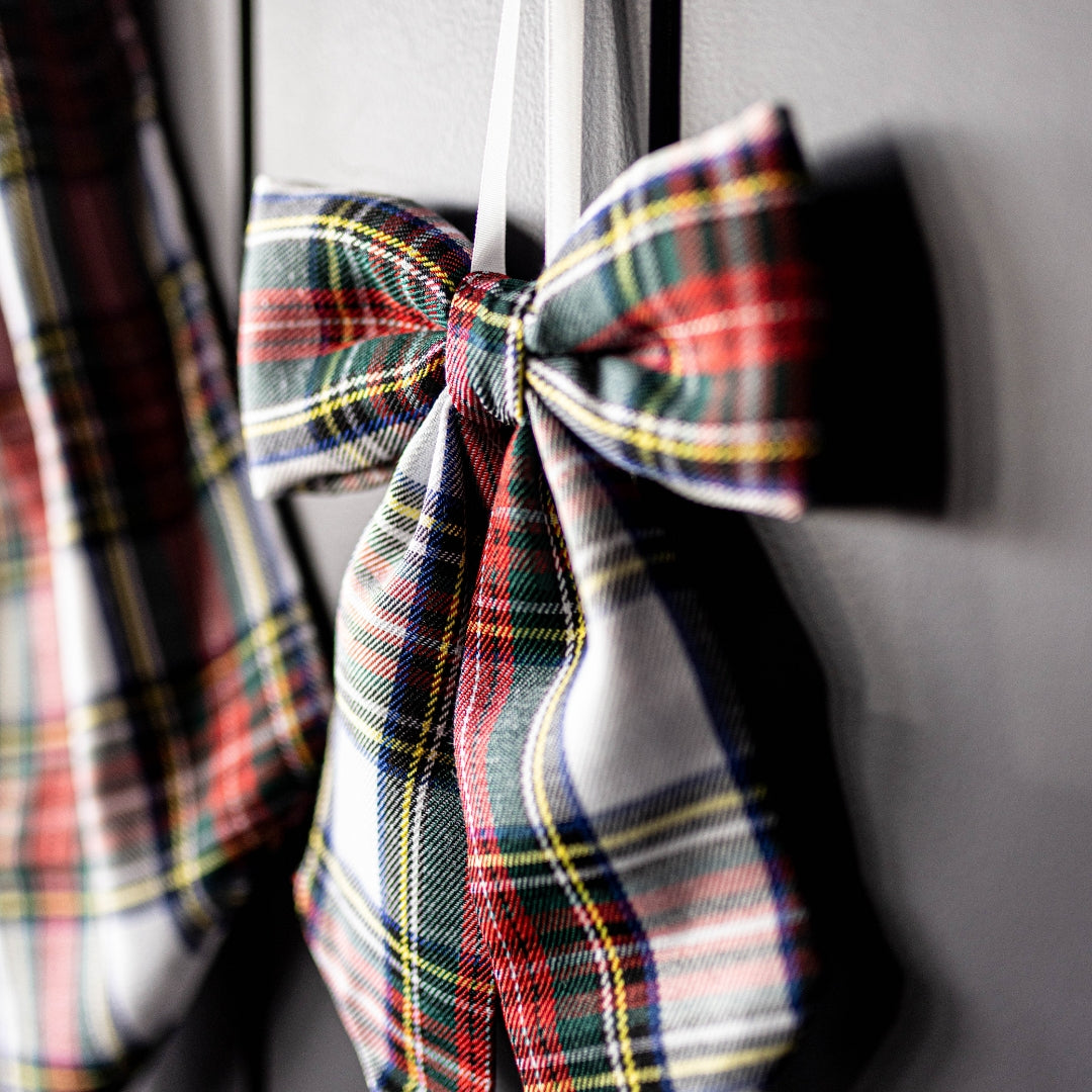 Plaid bow tie on a gray background