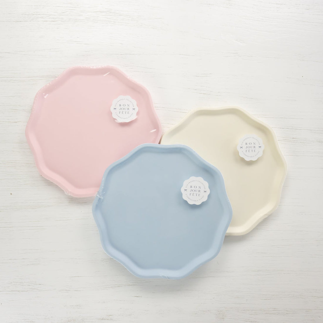 Three pastel-colored plates on a light gray background.
