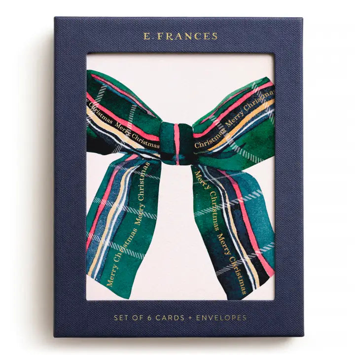 E. Frances Christmas card and envelope set in a navy blue textured box with a clear window showing a green plaid bow printed on the front.