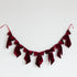 Red velvet bow banner on a white background.