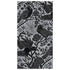 A rectangular guest napkin featuring an illustrated pattern of black birds and flowers on a metallic silver background.