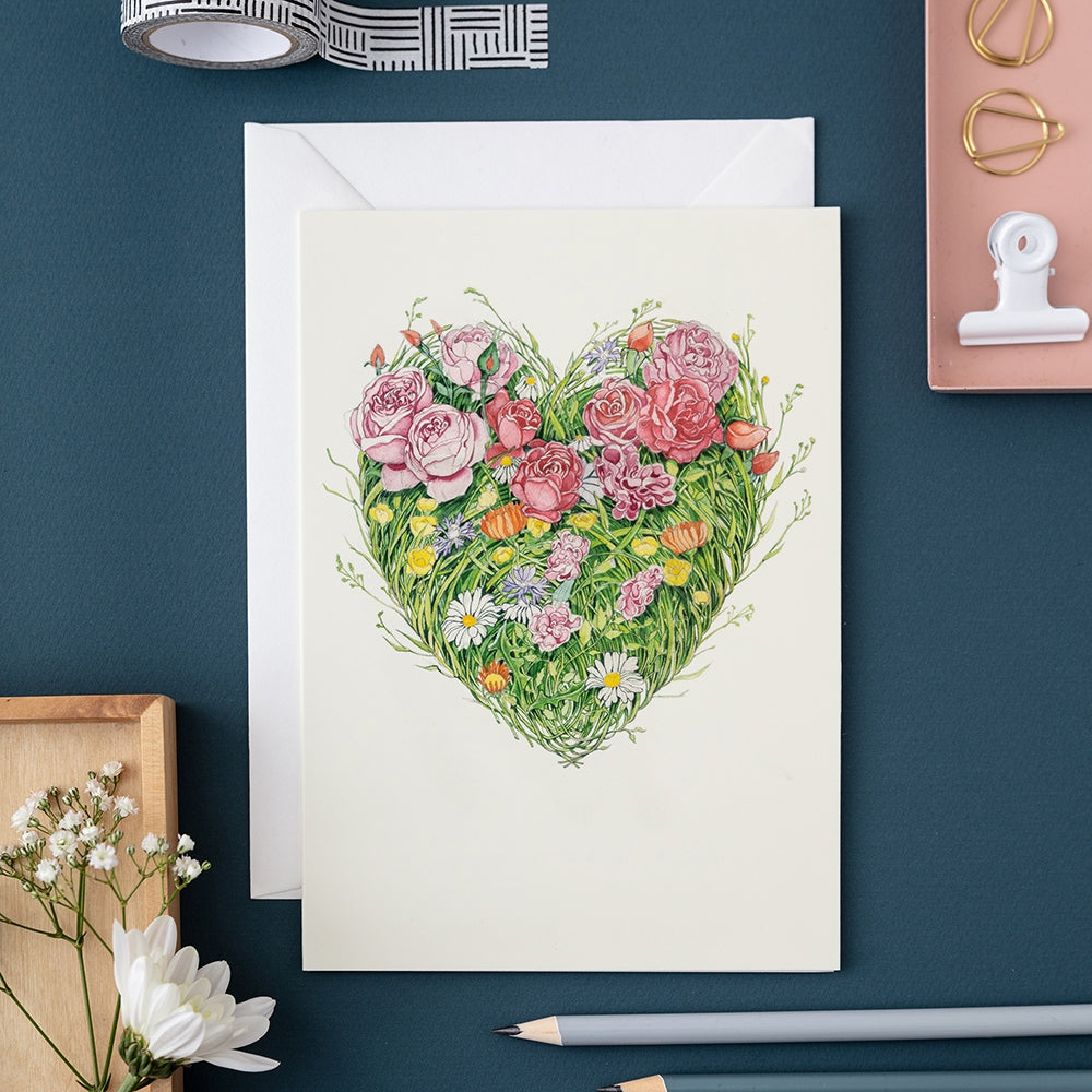 An illustration of a Grass Heart Card from The DM Collection, on a blue background, perfect for high-quality thank-you cards.