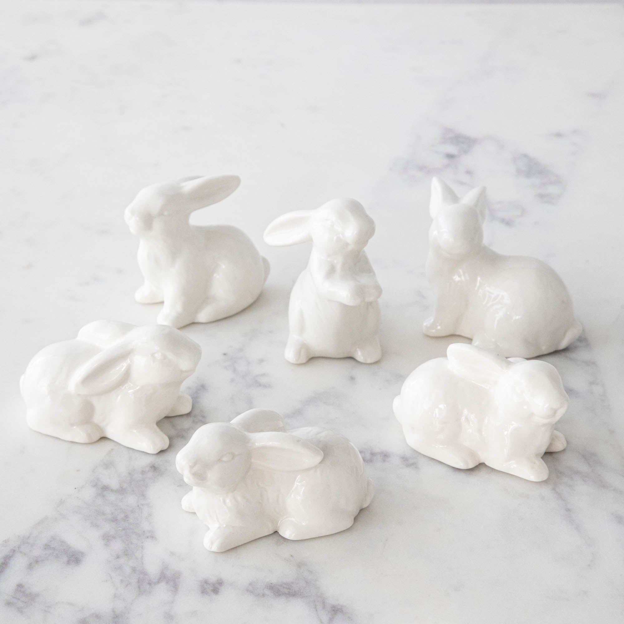 A group of Creative Co-Op Ceramic Bunnies, Set of 6.