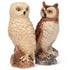Two owl figurines on a white background.