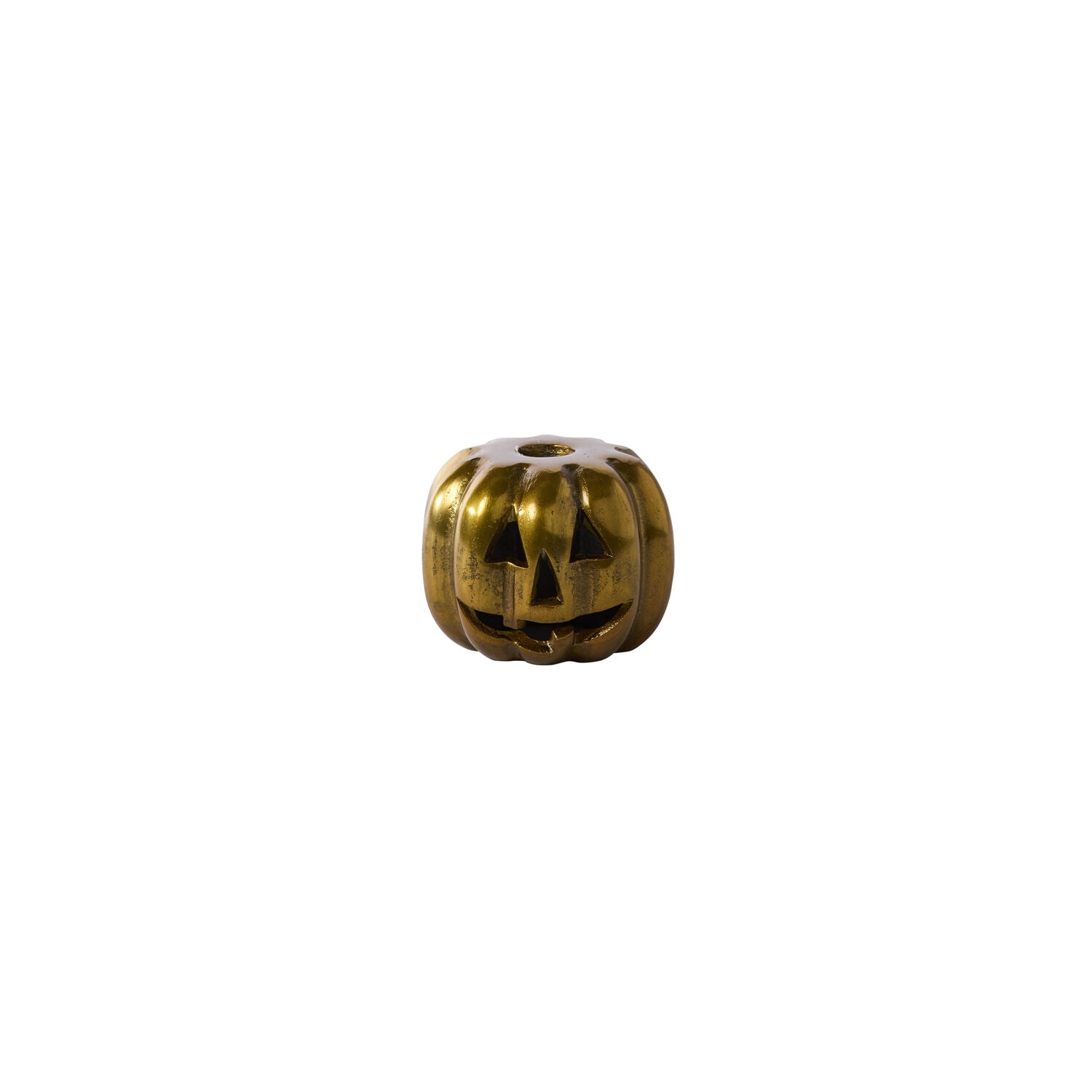 Gold pumpkin-shaped candleholder with a face on a white background.