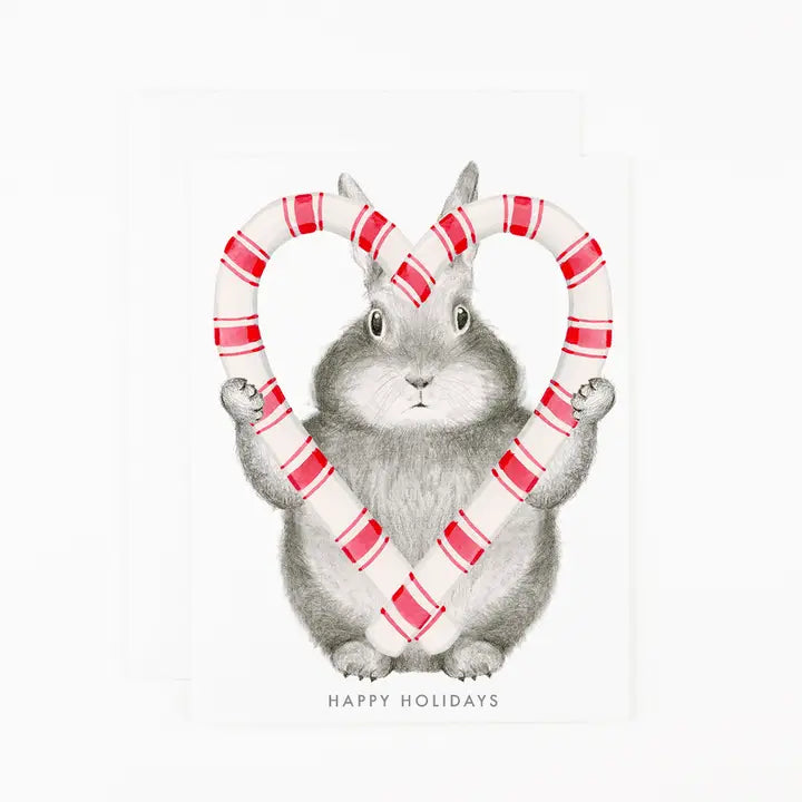 Illustration of a rabbit holding candy canes with &