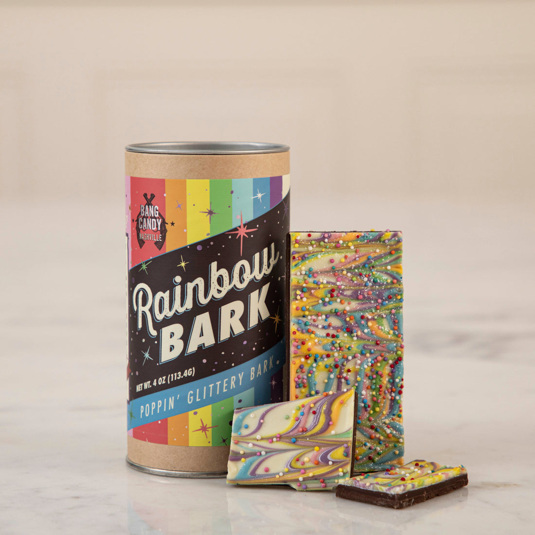 Indulge in the decadence of our Hester &amp; Cook Gluten Free Rainbow Bark chocolate bar, crafted with premium Belgian chocolate.