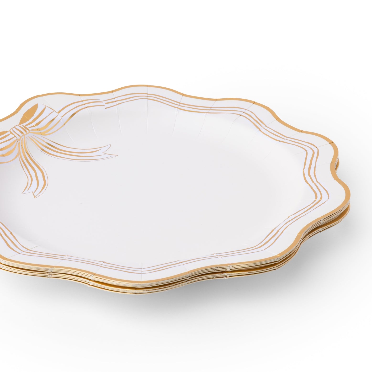 White plate with gold decorative edge on a white background.