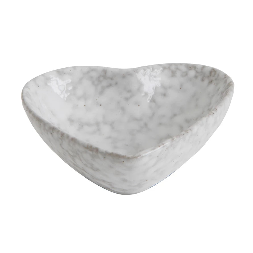 A Stoneware Heart Dish from Creative Co-Op, perfect for decorative purposes or holding rings, is displayed on a clean white background. The size of the dish is ideal for small items.