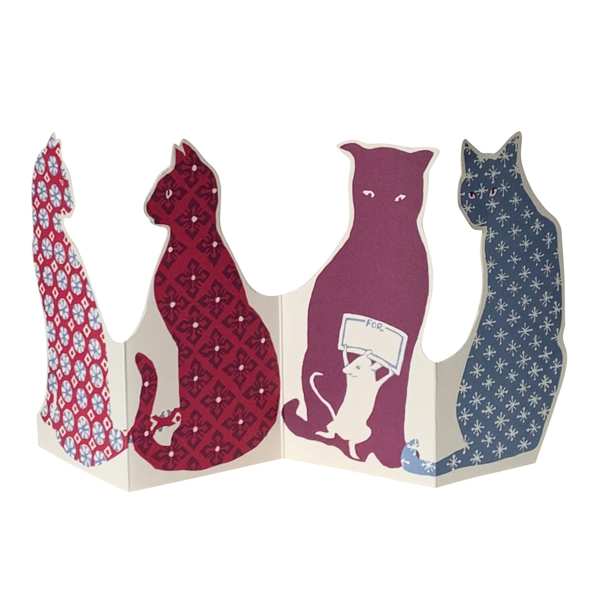 Greeting card in the shape of cats with calico printing on them. 