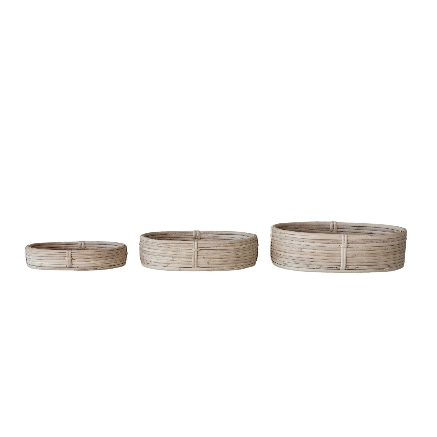 Three round woven planters of different sizes on a white background