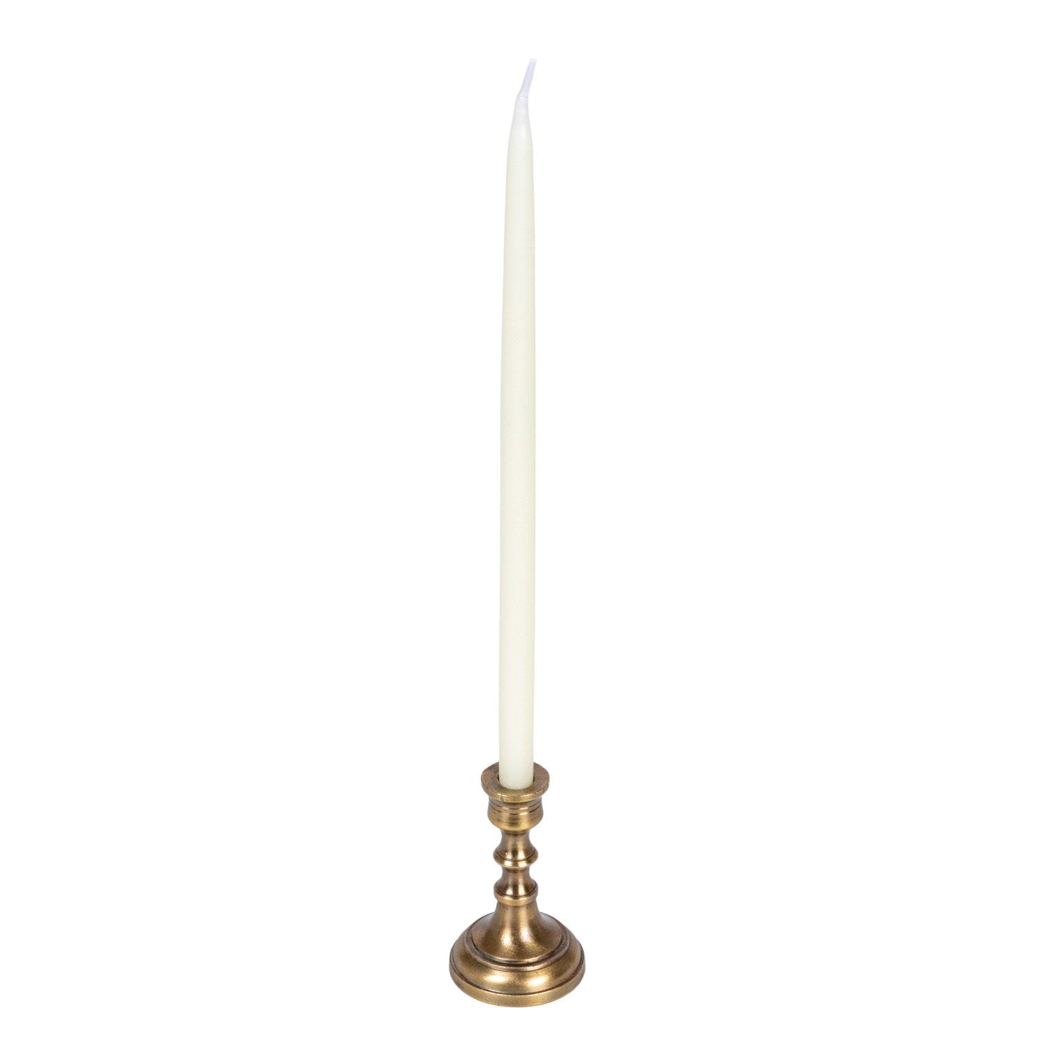 White candle on a brass candlestick against a white background.
