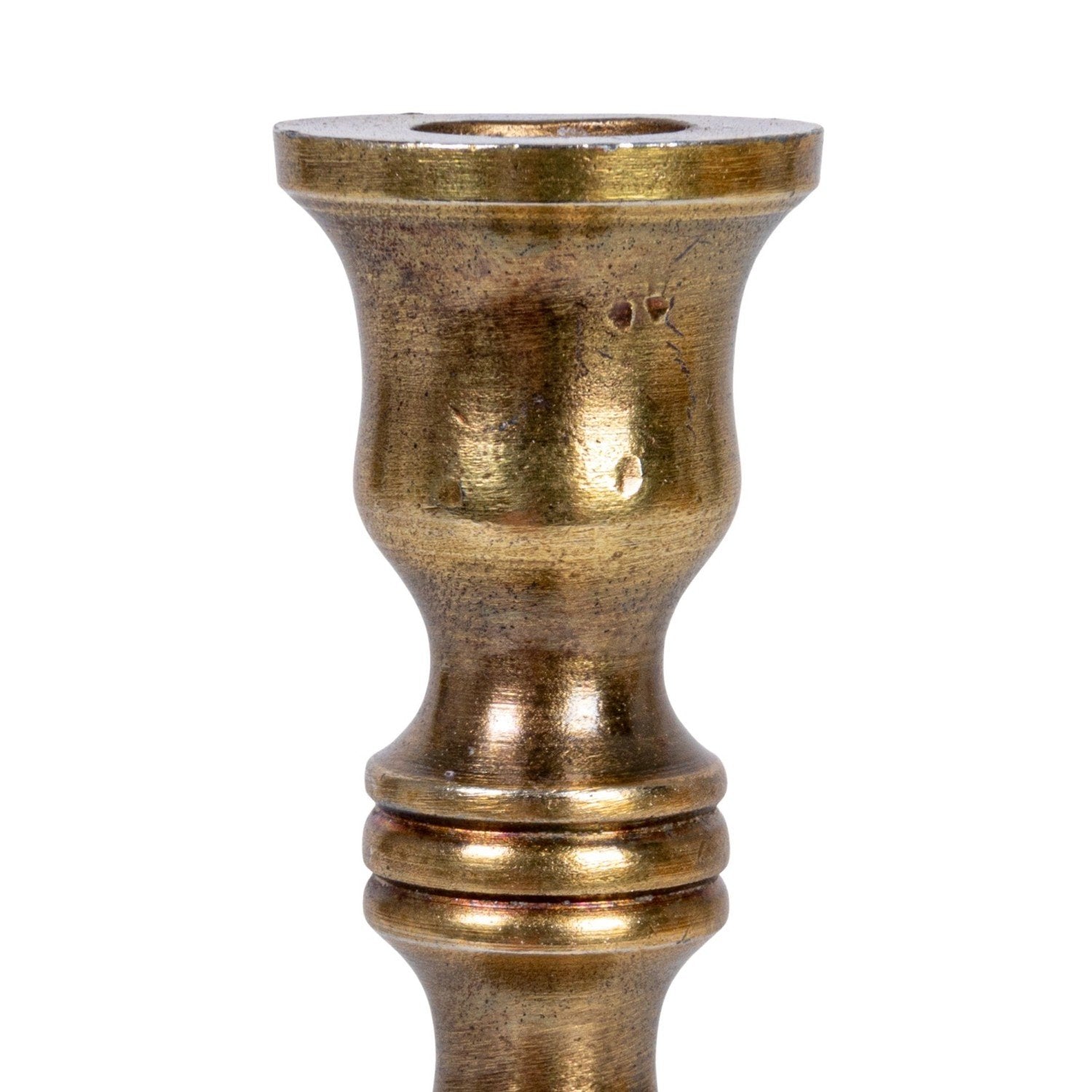 Brass candle holder on a white background.