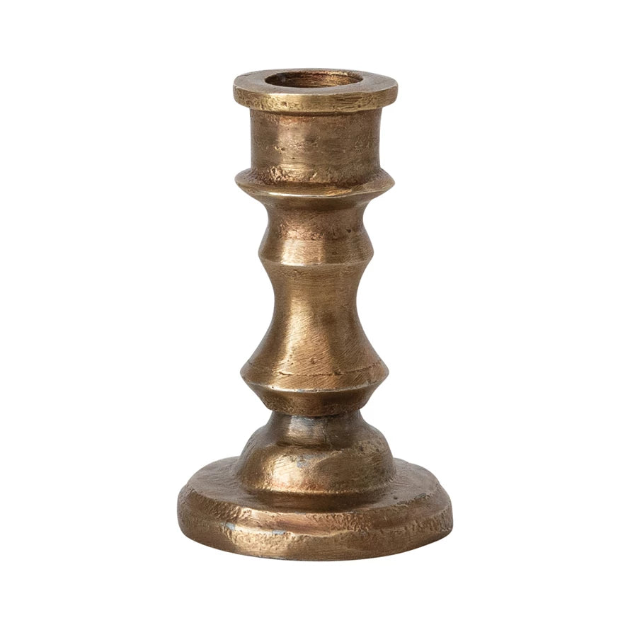 Bronze candle holder on a white background.