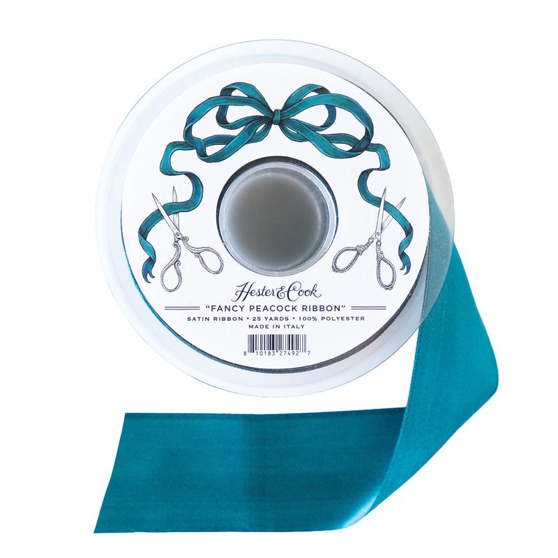 A spool of deep teal satin ribbon by Hester &amp; Cook on a white background. 