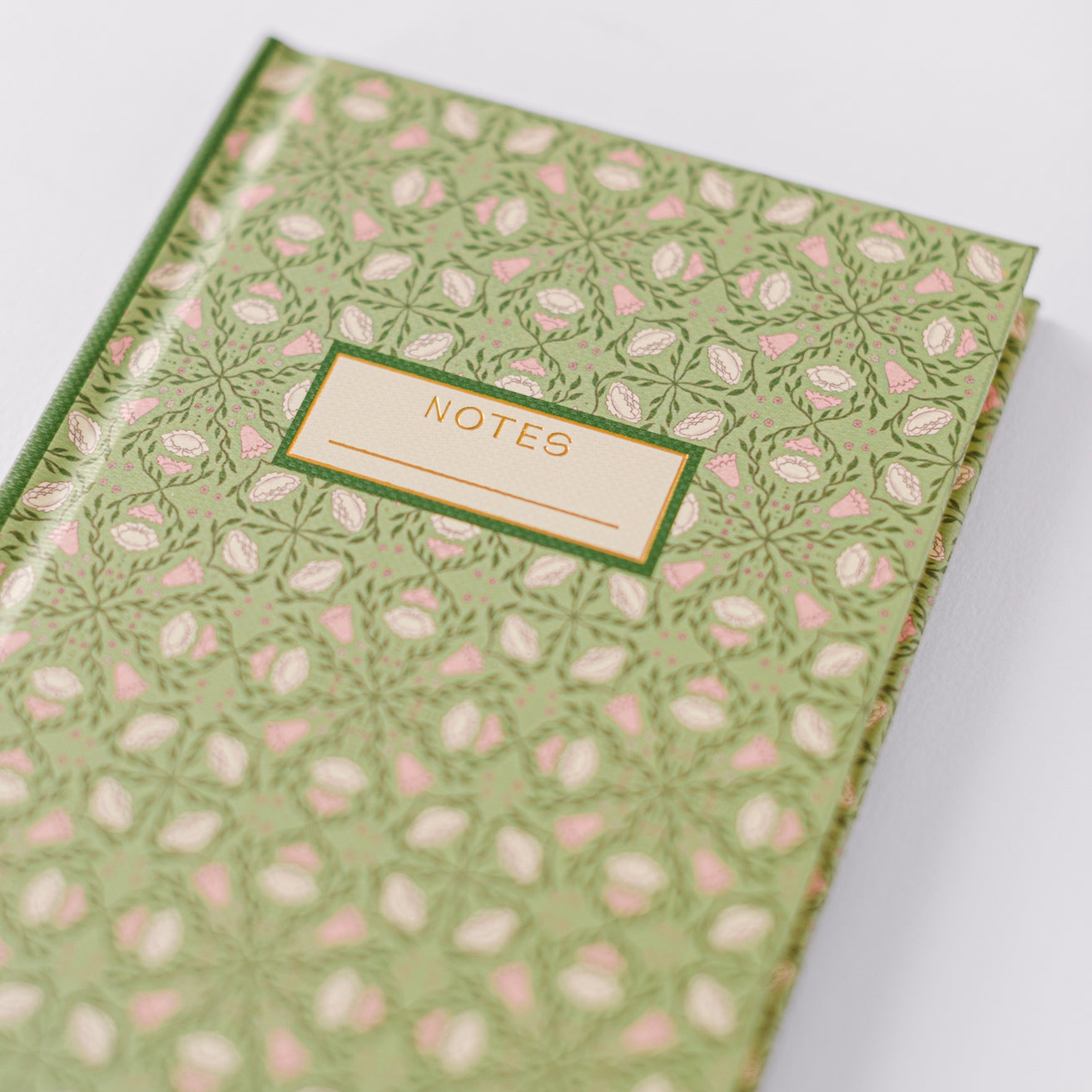 Close up of the front of the green notebook