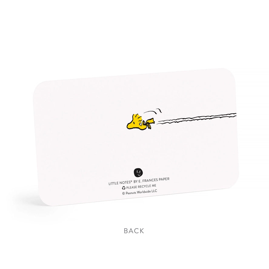 The back of a white Little Notes by E. Frances Paper recycling card, featuring a yellow bird running with a black squiggle trail and recycling text, on a white background with the word &