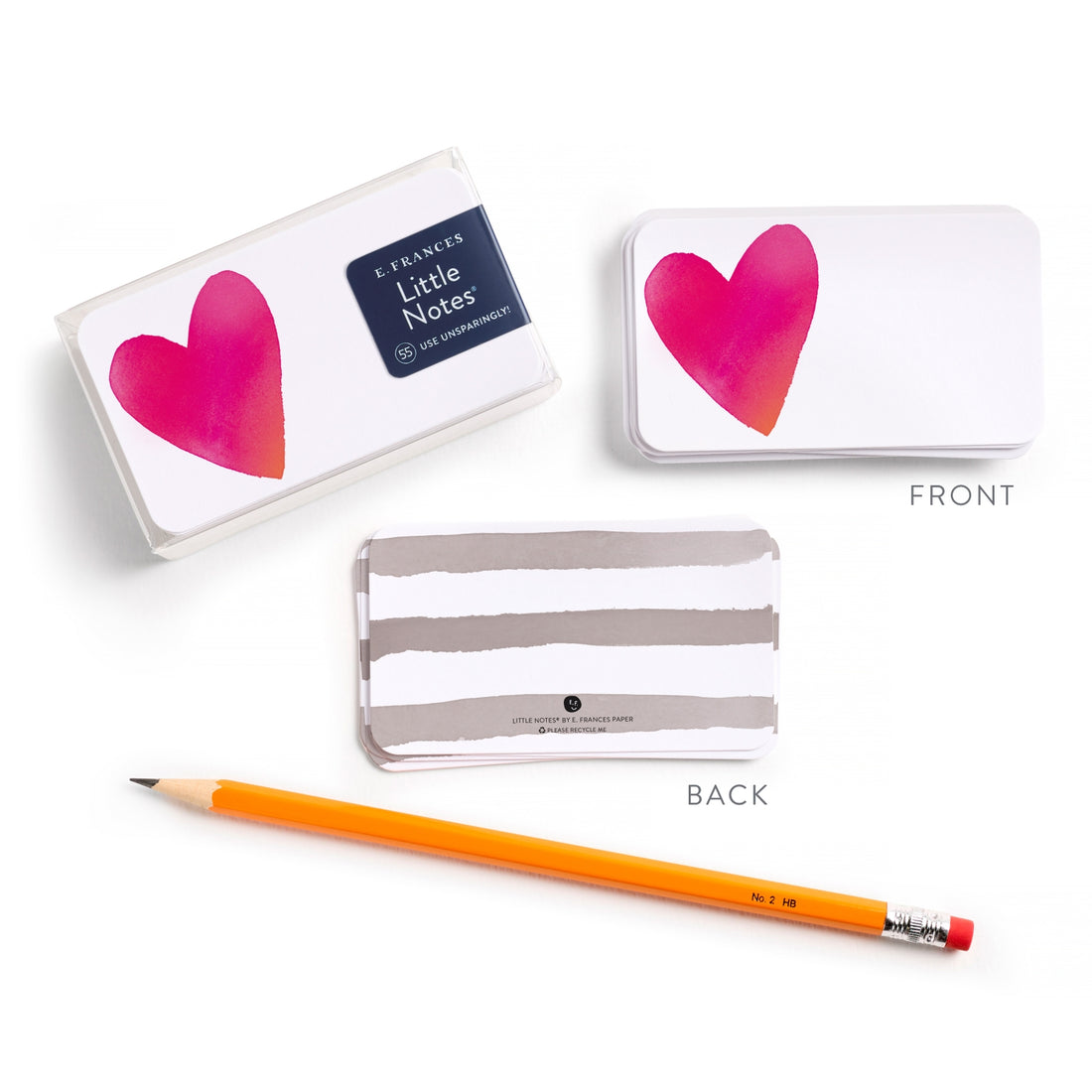 Little Notes with heart design, pencil, and clear case on a white background.