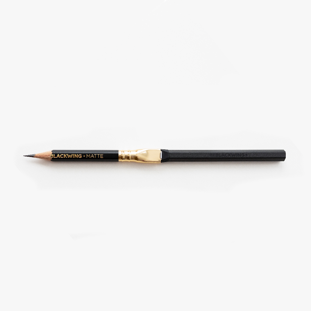 A Blackwing Pencil Extender on a white surface.