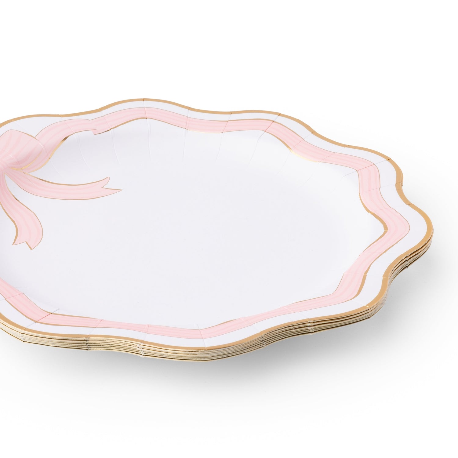 Set of white plates with pink rims and gold edges on a white background.