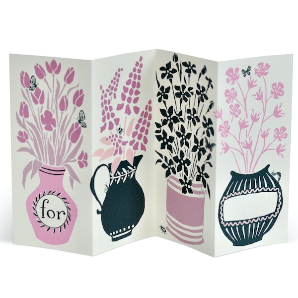 Fold-out card with floral and vase designs on a white background. 