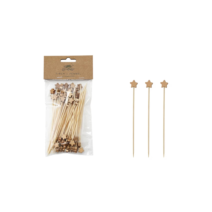 Packaged wooden skewers with star-shaped tips on a white background.