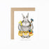 A greeting card with a hand drawn Dad bunny carrying carpenter&
