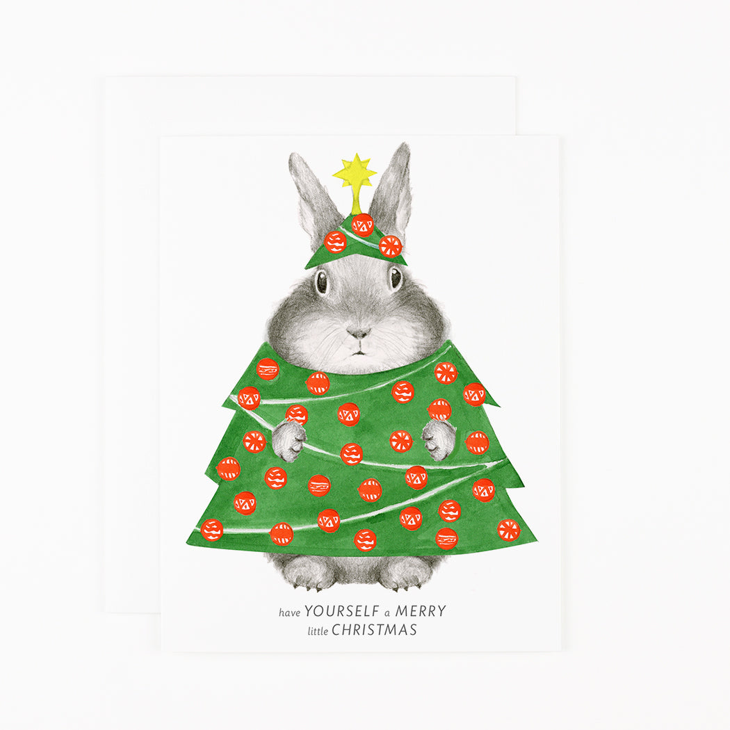 A Dear Hancock Bunny in Tree Costume with a Merry Little Christmas holiday tree costume and a star on its head.