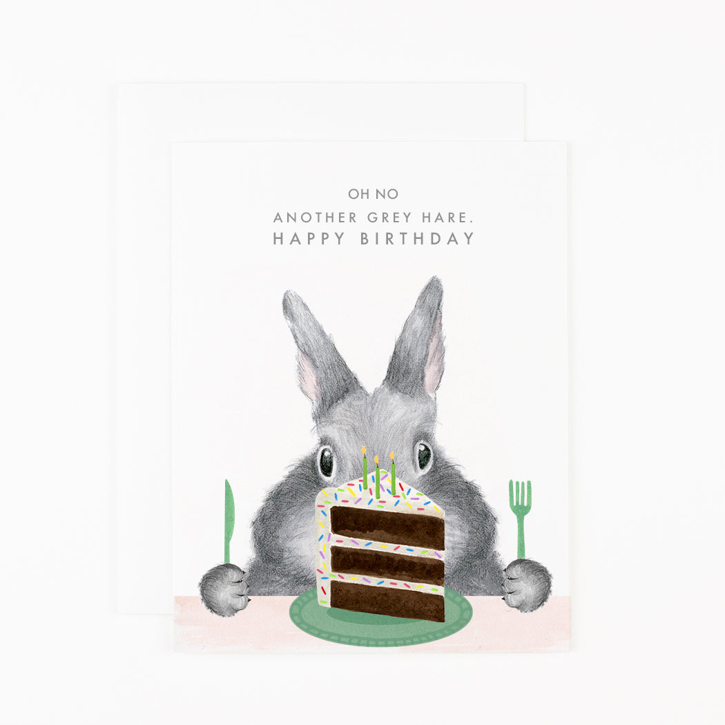 An Another Grey Hare Card by Dear Hancock, featuring a graphite bunny holding a fork and knife with a slice of cake in front of it. Text reads &