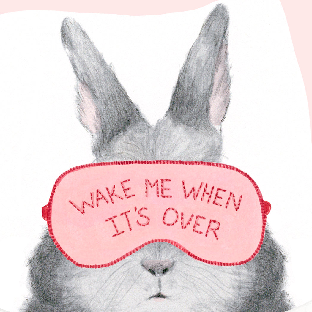 Illustration on soft white paper of a hand-drawn bunny wearing a sleep mask with the phrase "Wake Me When It&