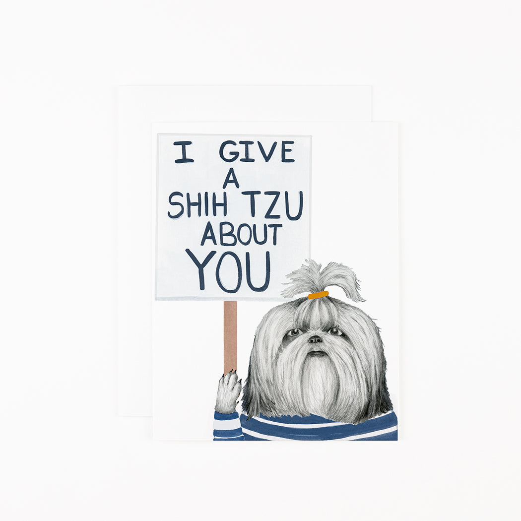 A hand-drawn Shitzu holding a sign that reads &quot;I give a shih tzu about you&quot;