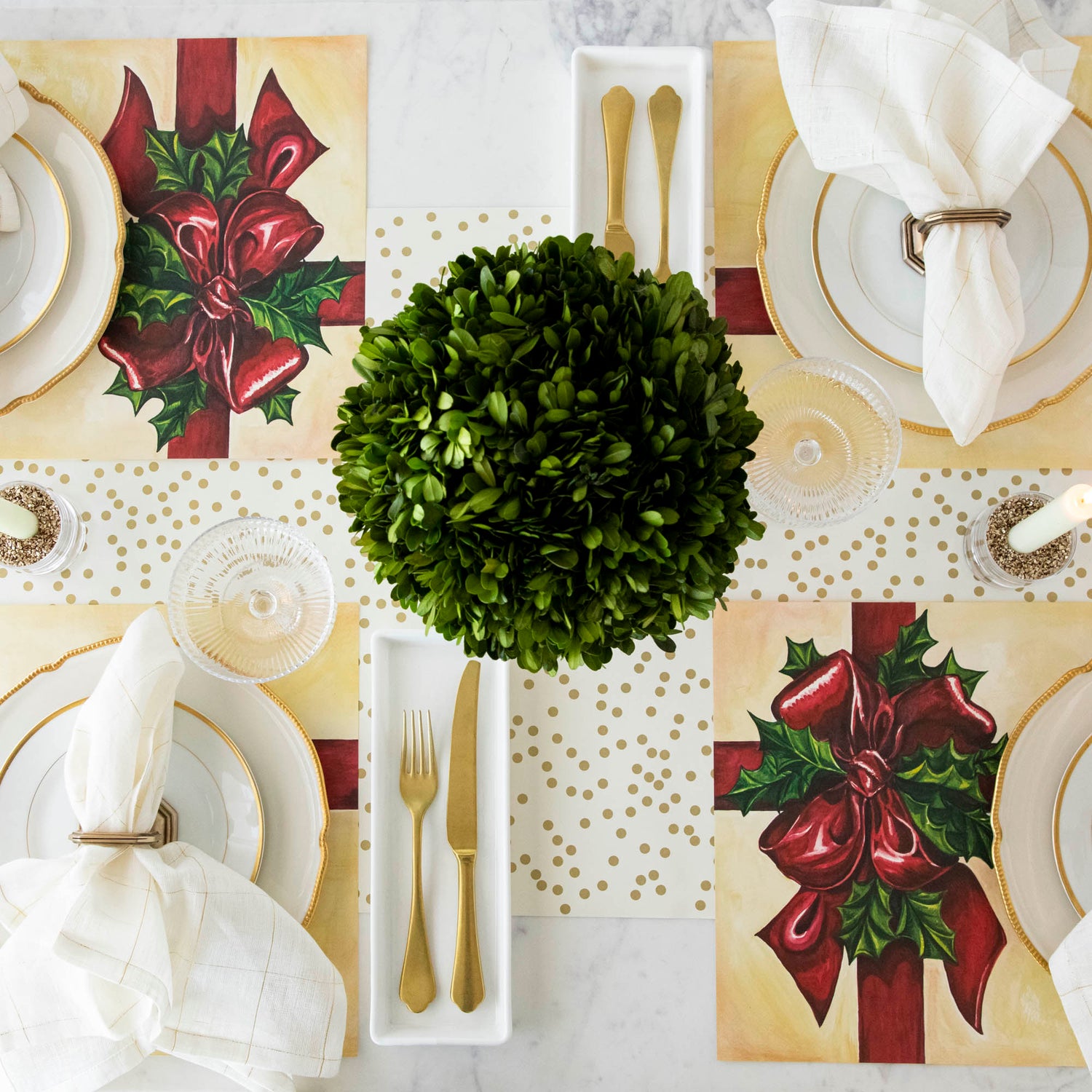 Christmas table setting with 4 place settings that have the Christmas Present Placemat
